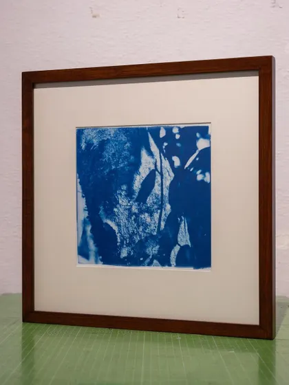 A framed abstract cyanotype, showcasing how we can create a cohesive series of works based on a client's vision.