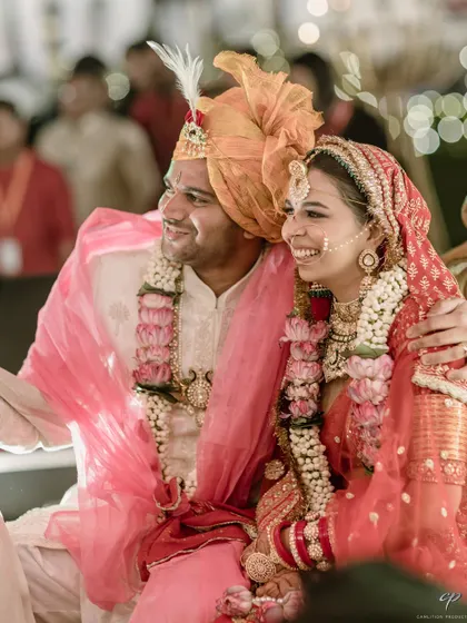 A candid shot of a couple, smiling and happy during their ceremony. These are the unposed, genuine moments of joy that truly define a wedding day.