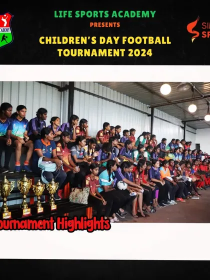 Teams watch from the sidelines at the football tournament. The atmosphere of a competition, with trophies on display, inspires every player to give their best.