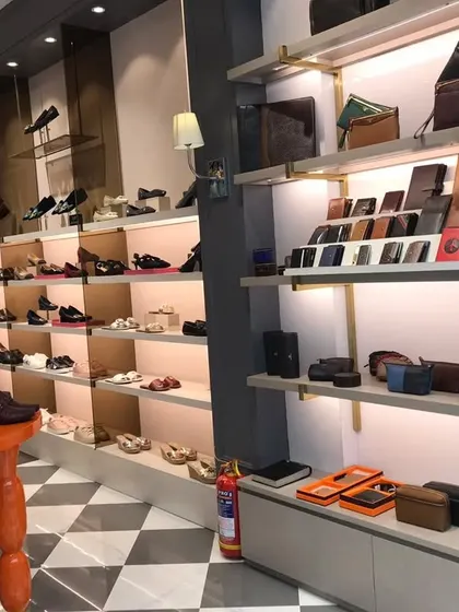 The shoe and small leather goods section in the Rosso Brunello part of the store.