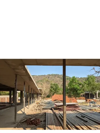 Another view of the family commune under construction in Alibaug. The concrete structure establishes the long, linear form of the homes, which are designed to allow for both privacy and collective living.