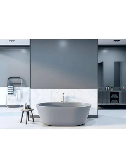 A minimalist bathroom featuring a freestanding bathtub as the centerpiece. The cool grey walls and simple, clean lines create a serene and contemporary atmosphere.