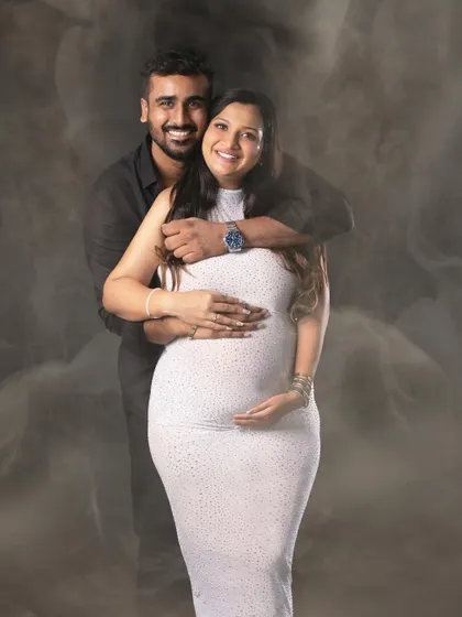 A joyful portrait of the couple embracing, with the smoky background adding a unique, ethereal quality.