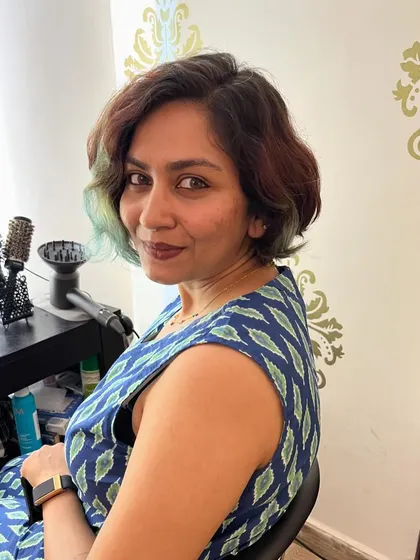 A hint of green adds a playful touch to this pixie.