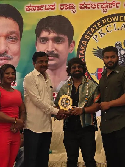 Presenting an award at the PK Karnataka State Weightlifting Championship. It's great to see the next generation of athletes competing.