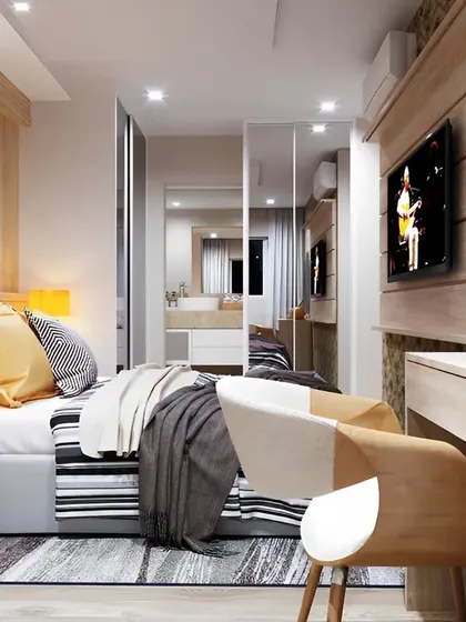 This bedroom design makes clever use of mirrors to create an illusion of space. We installed a full-length mirrored wardrobe and a compact study-cum-vanity table, making the room feel larger and brighter.