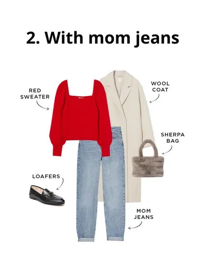 A red sweater with mom jeans and a classic wool coat is an easy and stylish outfit for a cold day. The loafers and sherpa bag add cozy and classic touches.