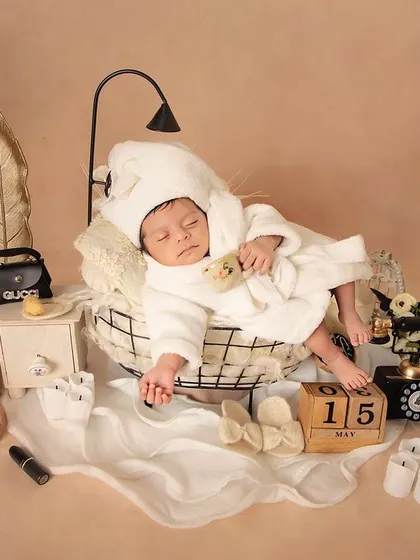 Peace and quiet at the baby spa. This shot shows the baby sleeping soundly, surrounded by all the tiny props that make this theme so delightful.