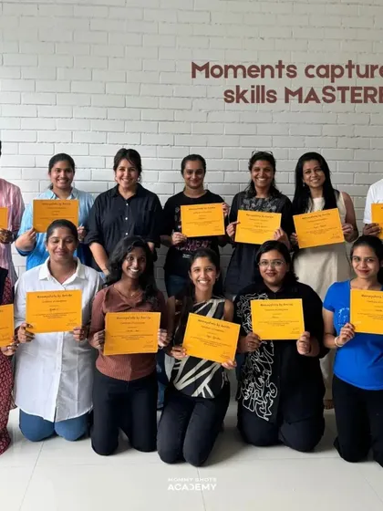 A group photo of smiling workshop graduates, showcasing the positive and successful learning environment.