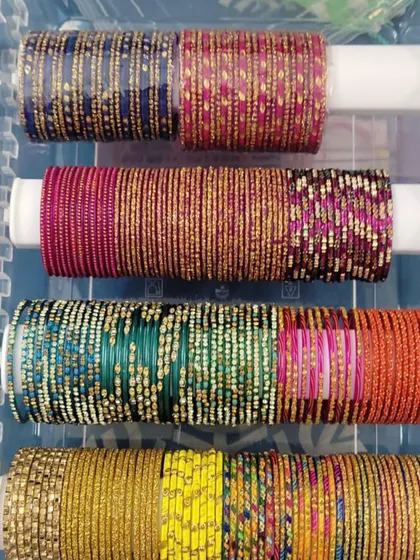 A close-up of a perfectly organized bangle box. We categorize by color and style, so finding the perfect accessory for your outfit takes only a few seconds.