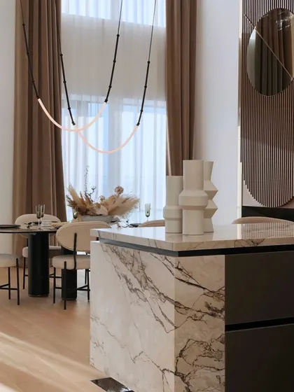 A close-up view of the Leda fixture in a high-end residence, showing how it complements the beautiful marble and modern furnishings.