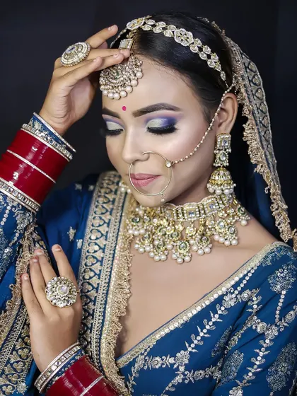 A close-up of the glittery blue and purple eye makeup, demonstrating the student's skill in color blending and application.
