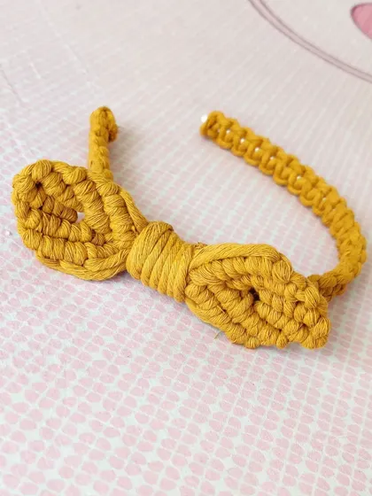 I made this cute macrame bow hairband for a client's daughter. It's a unique, knotted accessory that is both playful and stylish for little ones.