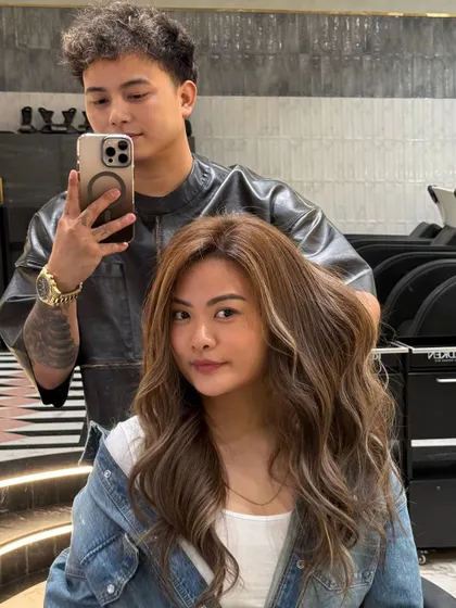 A closer look at the client and her new ash blonde hair. The color is a perfect mix of cool and neutral tones for a sophisticated finish.