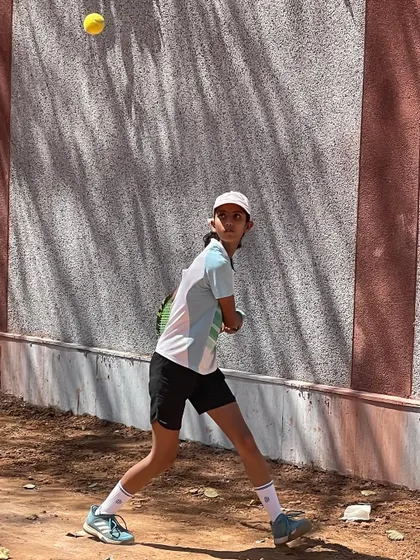 A player practicing against the wall, a classic drill for improving consistency and timing.