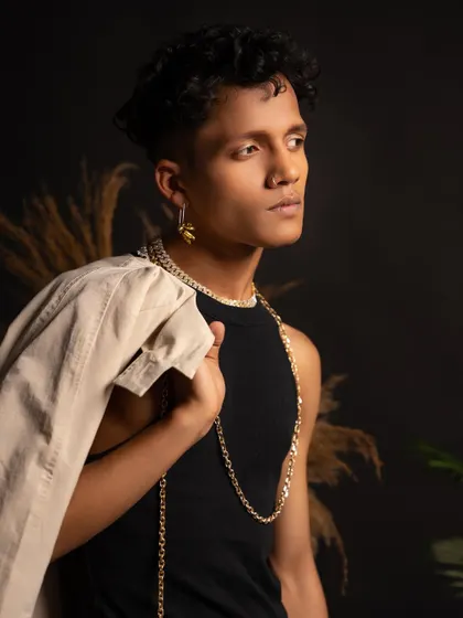 A profile shot from a classy photoshoot, showing off the styling and accessories that complete the look.