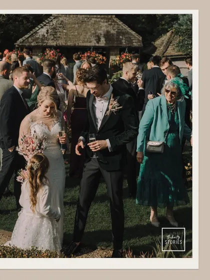The couple mingles with guests, including a little flower girl, capturing the relaxed and joyful atmosphere of the day.