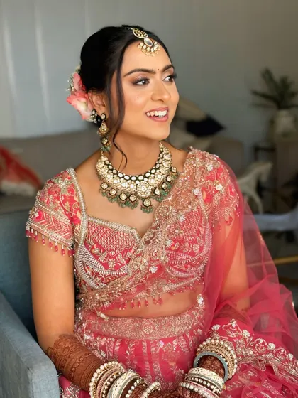 The updo is designed to be comfortable and secure, ensuring the bride looks flawless throughout her wedding ceremony.