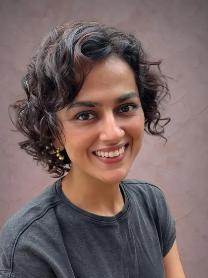 Shraddha looking radiant with her new curly cut and subtle highlights.