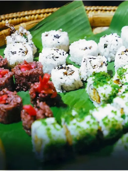 A beautiful assortment of sushi, including unique beetroot-colored rice rolls. We love to innovate and present classic dishes in new and exciting ways.