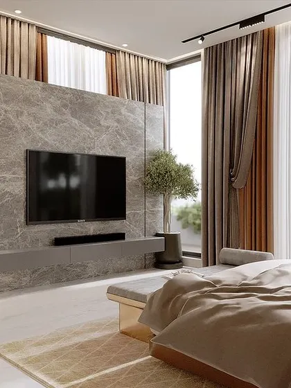The TV wall in the modern bedroom, featuring a beautiful marble finish that complements the warm wood tones. The floor-to-ceiling windows offer an expansive view, making the room feel bright and airy.