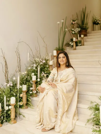 The birthday girl posing on the decorated staircase. Our goal is to create beautiful spaces where you and your guests can capture wonderful memories.