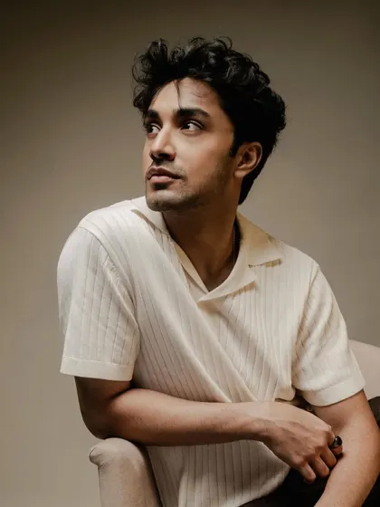 A seated portrait from the same series. This look is perfect for an editorial or personal branding photoshoot, showcasing a sophisticated yet approachable style.