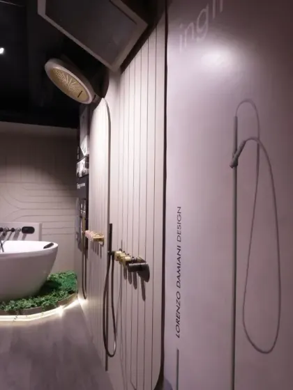 A side view of the freestanding tub display, emphasizing the soft, ambient lighting and the clean lines of the fixtures. The design creates a tranquil mood, suggesting a personal sanctuary.