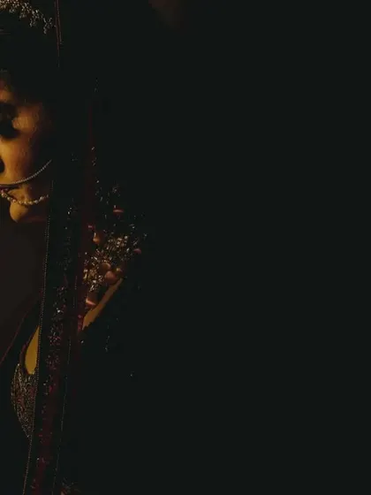 A dramatic, low key bridal portrait. Using shadow and a single light source, we create a moody and artistic image that highlights the bride's profile and jewelry.