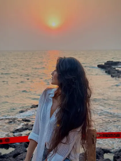 Looking out at the horizon as the sun sets. Every trip is a chance to collect more sunsets and salty hair memories.