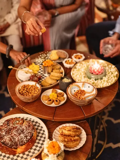 Another angle of our festive grazing setup, showcasing a mix of sweet and savory options like our pull-apart babka, gujiyas, and assorted nuts and cheeses.