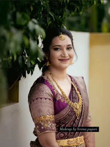 A beautiful outdoor portrait. The soft, natural lighting highlights the flawless finish of the makeup.
