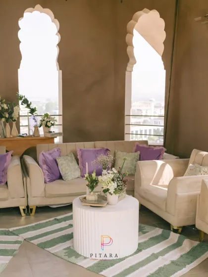 This lounge is giving main character energy. We set up this chic seating area with a stunning city view, using plush beige sofas, pops of lavender, and a modern striped rug to create a sophisticated yet relaxed vibe.