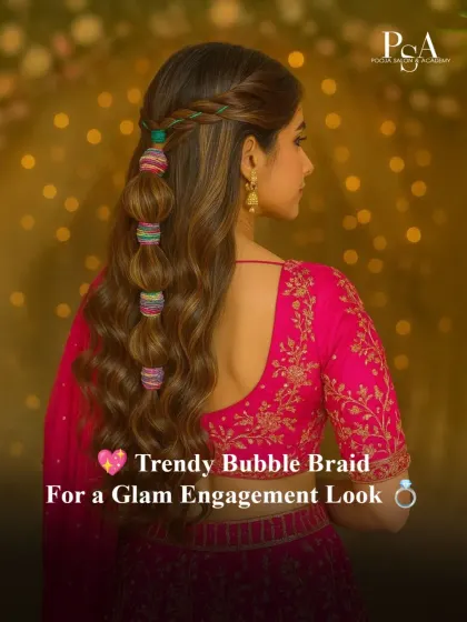 For an engagement or sangeet, a trendy yet elegant hairstyle can make all the difference. This playful bubble braid, accented with colorful threads, is a perfect example of how we customize styles to match the function's vibe and your outfit.
