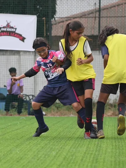 A testament to the grit and determination of our girls' team, fighting for every ball in a tough league encounter.