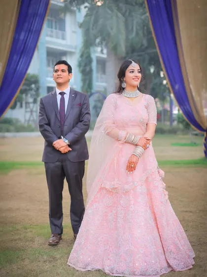 A candid-style portrait of the couple in an outdoor setting.