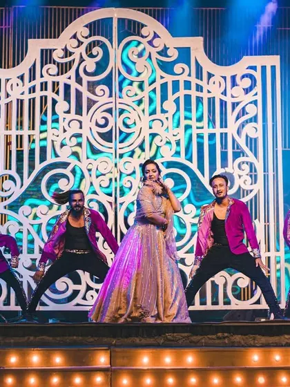The bride takes center stage for her solo performance, backed by our team of professional dancers who add energy and scale to the act.