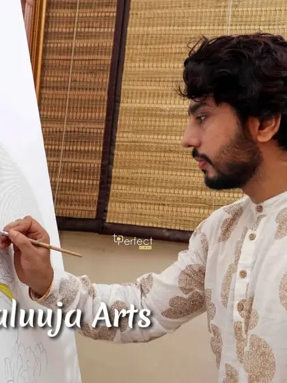 A close-up of me painting a Krishna pichwai, a traditional style of devotional art. This form of painting requires immense focus and is a deep meditative practice for me.