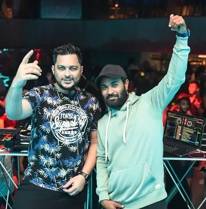 Posing with another DJ during a packed Saturday night. The DJ community in Bangalore is vibrant, and I love working with other artists to create memorable events.
