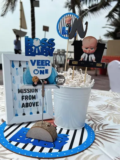 A 'Mission From Above' centerpiece for the Boss Baby party, featuring the main character and a custom-framed sign.