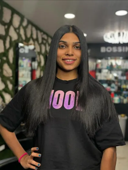 This client is rocking her silky perfection after a hair smoothening treatment. Her hair dreams have come true at our salon.
