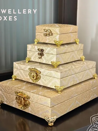 This set of four stacking jewelry boxes is one of my most popular trousseau items. Covered in a beautiful cream and gold brocade fabric with ornate clasps, they are perfect for organizing all your precious jewels.