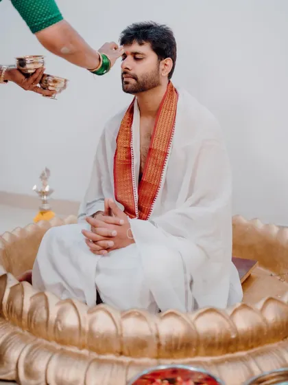 The groom's Haldi ceremony, featuring our custom-made golden lotus seat. We ensure that the decor is consistent and beautiful for both the bride and groom's events.