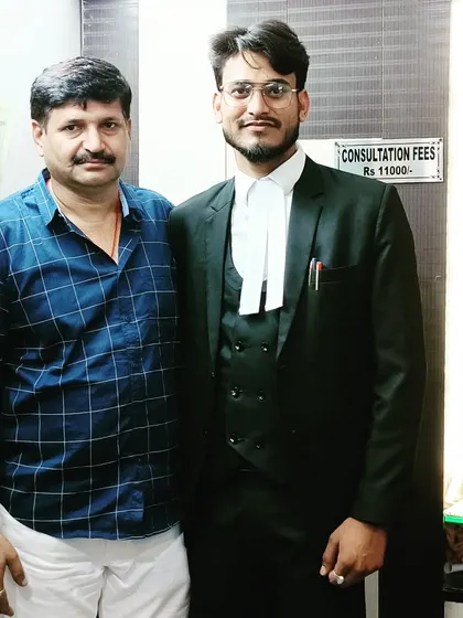 A proud moment with my father in my office. His support has been a constant source of strength.