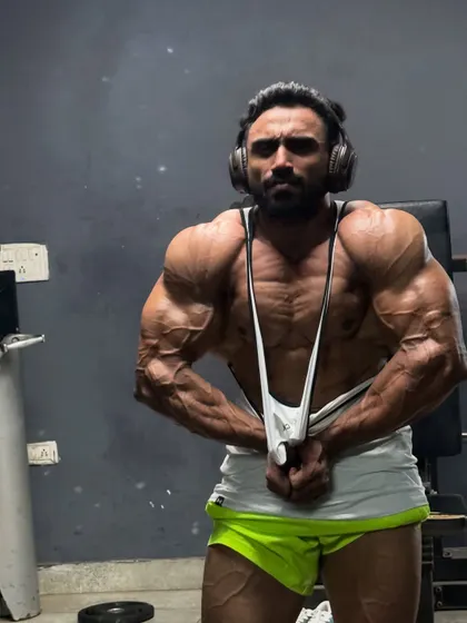 Hitting a side chest pose during a late-night session.