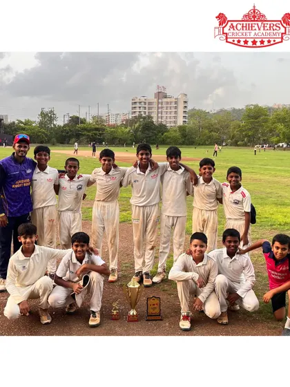 The victorious U-14 team with their coach, proudly displaying the AT Cup trophy and individual awards.