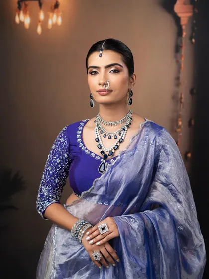 A direct portrait showing the flawless base and striking eye makeup of this glamorous evening look.