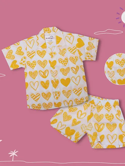 A closer look at our yellow heart-print co-ord set for boys. The detailed print and soft fabric make it a stylish and practical choice for the summer season.