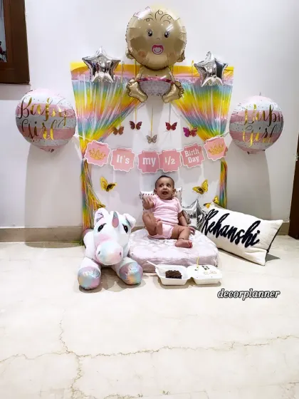 Six months of pure joy! I created this adorable half-birthday setup for little Rehanshi, complete with a rainbow backdrop, personalized cushion, and a cuddly unicorn. It’s the perfect way to celebrate being halfway to one.
