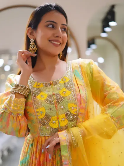 Not over how stunning this outfit is. A close-up of a multi-color printed Anarkali with a beautifully embellished yellow neckline.